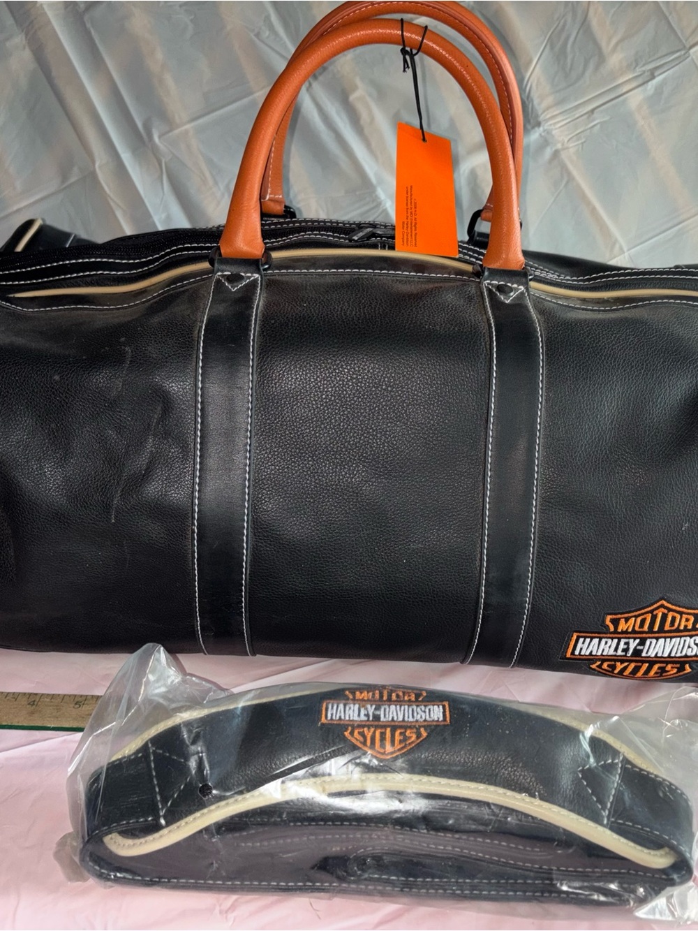 Harley-Davidson Black Duffel with Orange Handles and Orange Tag